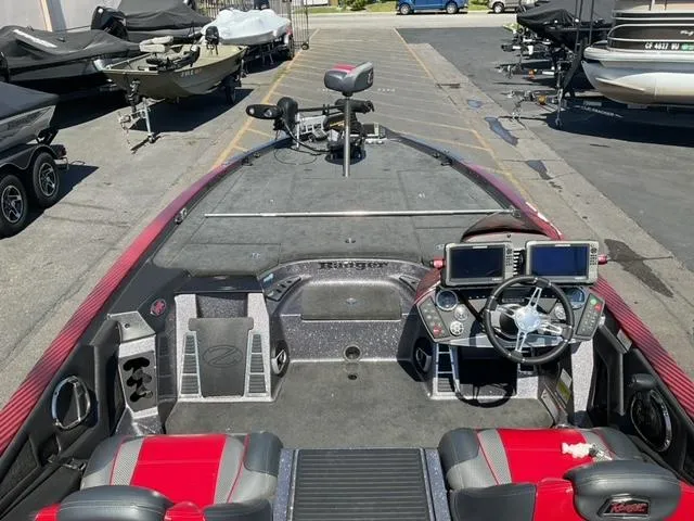 Slide: The Image of 2016 Ranger Z521 Comanche boat interior with advanced navigation systems and seating. - 11