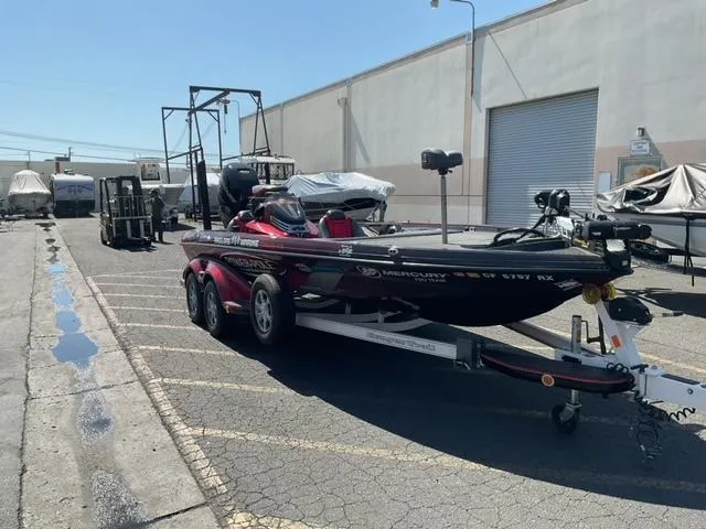Slide: The Image of 2016 Ranger Z521 Comanche boat on trailer in industrial parking lot. - 2