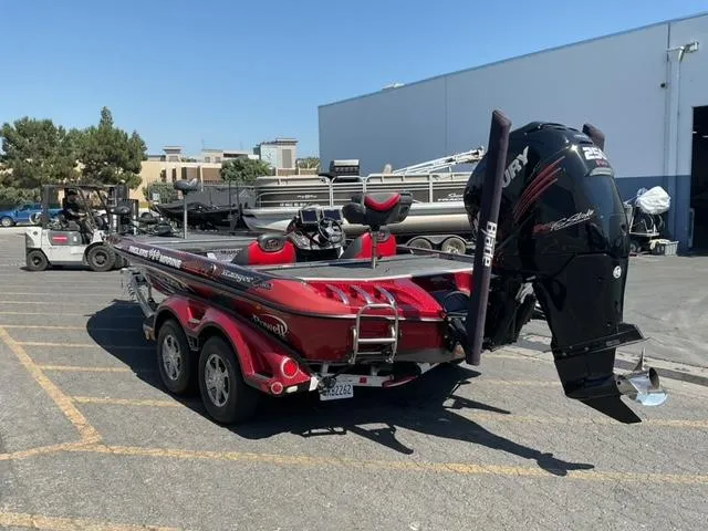 Slide: The Image of 2016 Ranger Z521 Comanche boat with Mercury engine in a parking lot. - 3