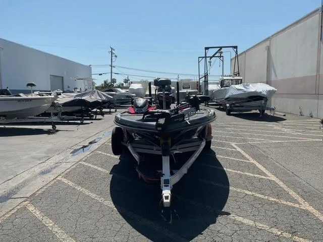 Slide: The Image of 2016 Ranger Z521 Comanche boat parked in a lot with other covered boats. - 5