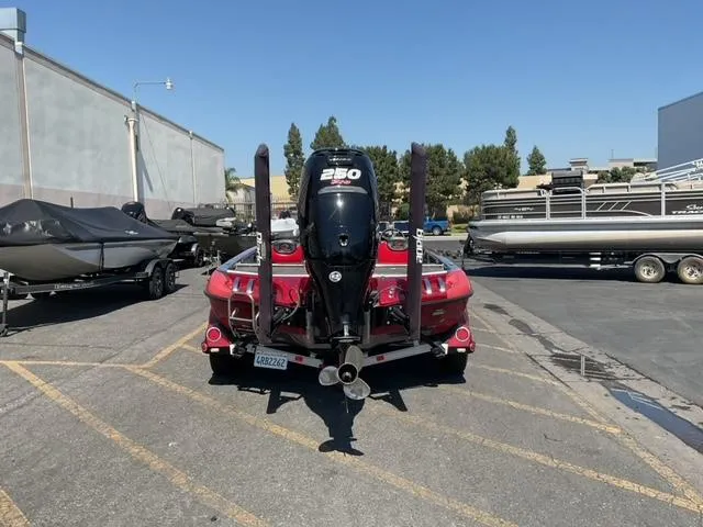 Slide: The Image of 2016 Ranger Z521 Comanche boat with powerful engine, parked outdoors on a sunny day. - 6