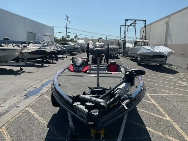 Slide: The Image of 2016 Ranger Z521 Comanche boat in storage lot with other covered boats. - 7