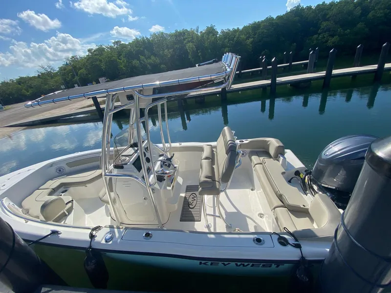 Slide: The Image of 2024 Key West 203 FS boat docked, featuring sleek design and spacious seating. - 3