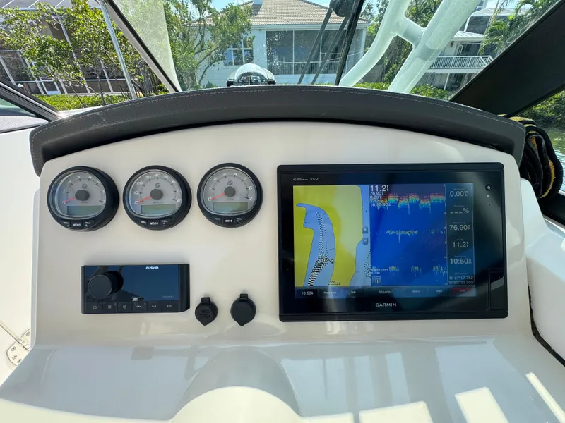 Slide: The Image of Dashboard of 2018 Boston Whaler 270 Vantage with navigation display and gauges. - 17