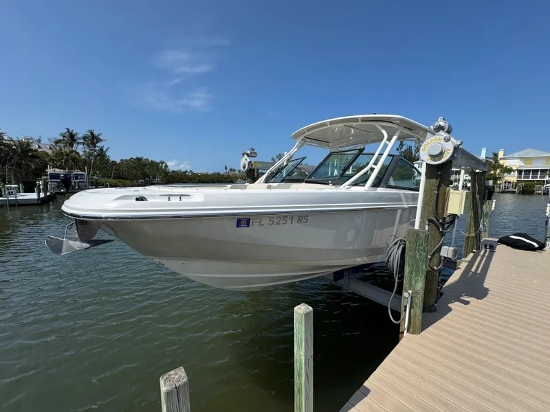 Slide: The Image of 2018 Boston Whaler 270 Vantage boat docked on a sunny day. - 5