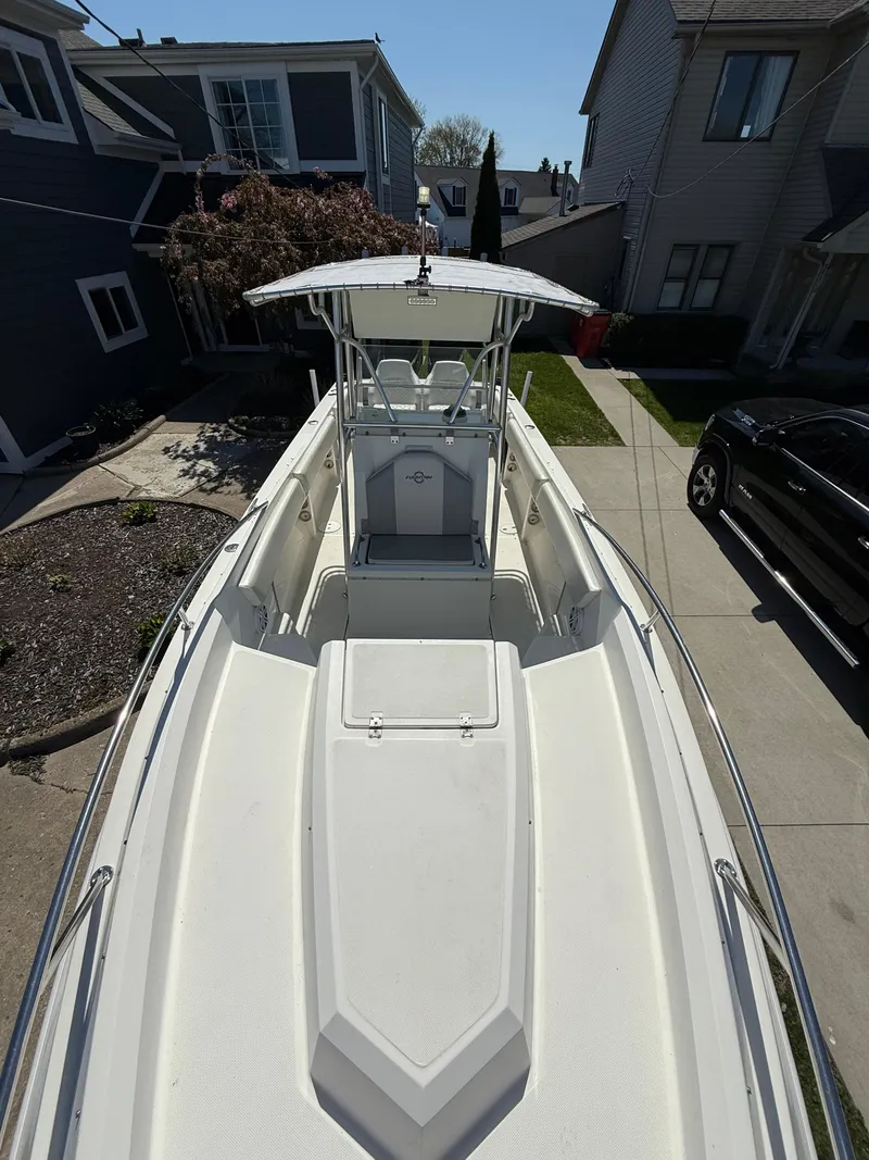 Slide: The Image of 1994 Fountain 31 Tournament Edition boat docked in residential driveway. - 12