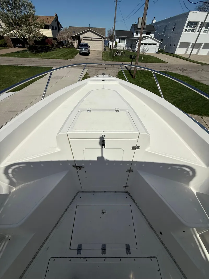 Slide: The Image of 1994 Fountain 31 Tournament Edition boat bow view, parked in a residential driveway. - 18