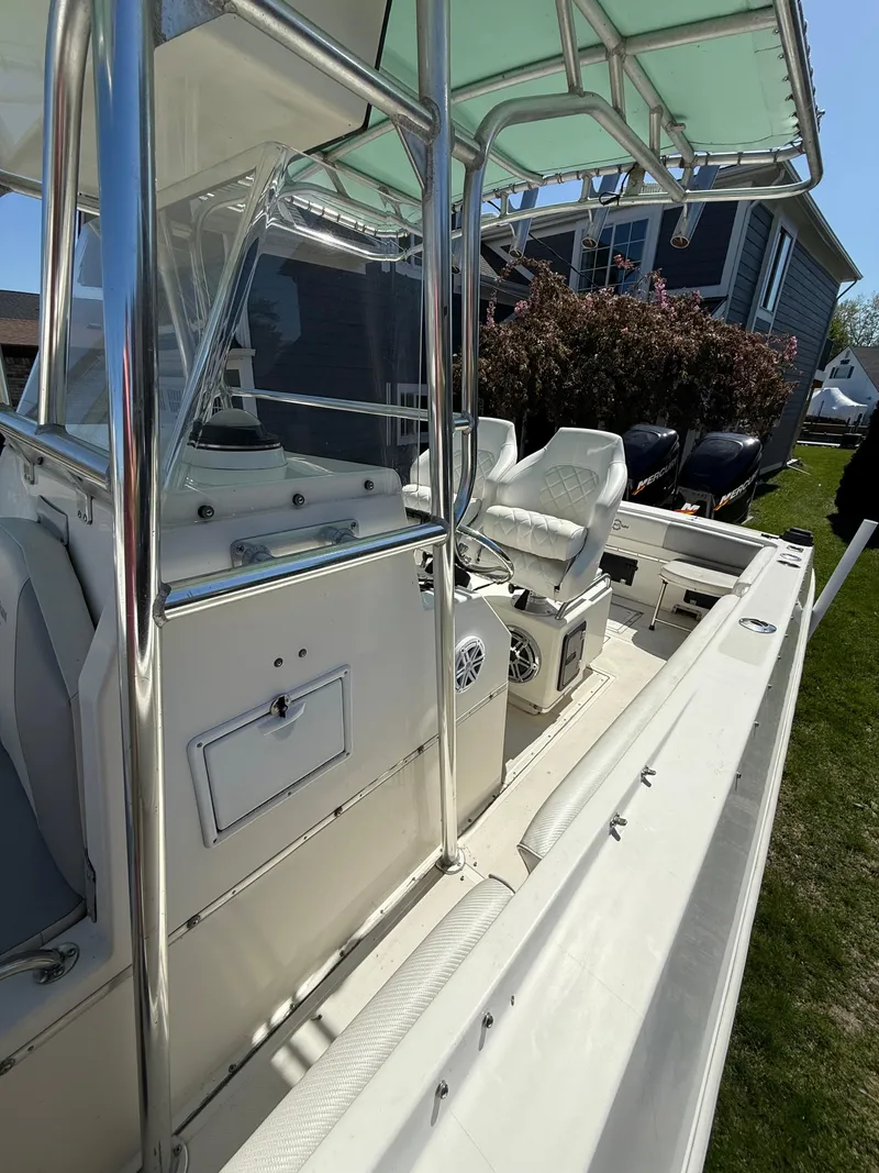 Slide: The Image of 1994 Fountain 31 Tournament Edition boat with white interior and canopy. - 22