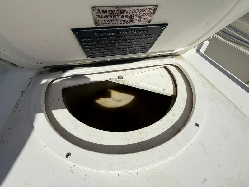 Slide: The Image of Open hatch on 1994 Fountain 31 Tournament Edition boat deck. - 25