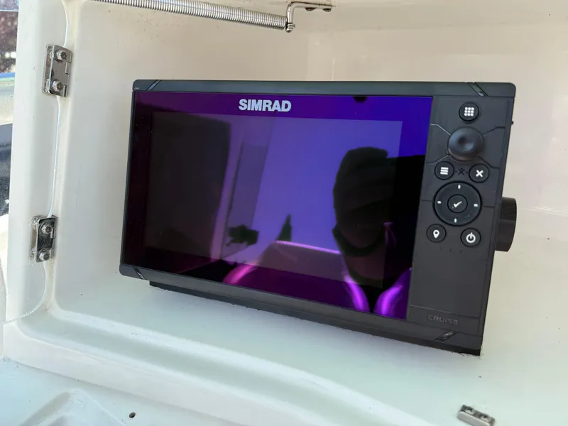 Slide: The Image of Simrad marine display on 1994 Fountain 31 Tournament Edition boat dashboard. - 26