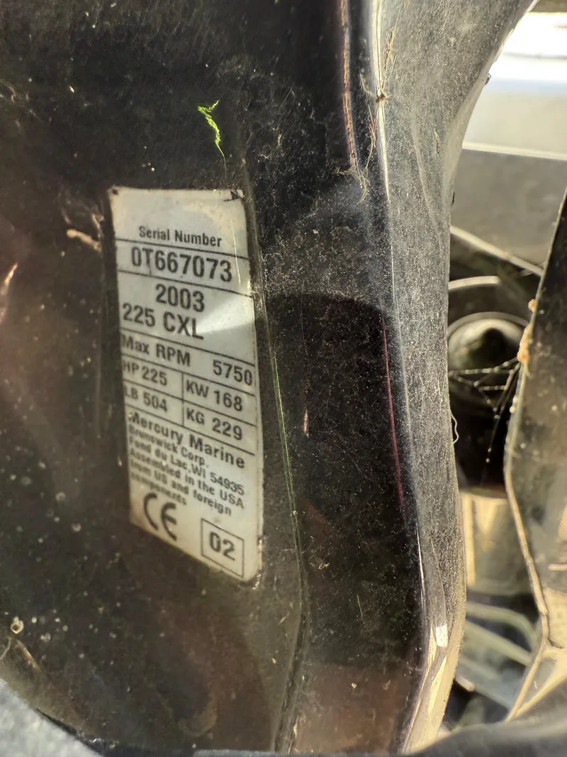 Slide: The Image of Label on a Mercury Marine engine, serial number OT667073, 225 CXL, max RPM 5750. - 33