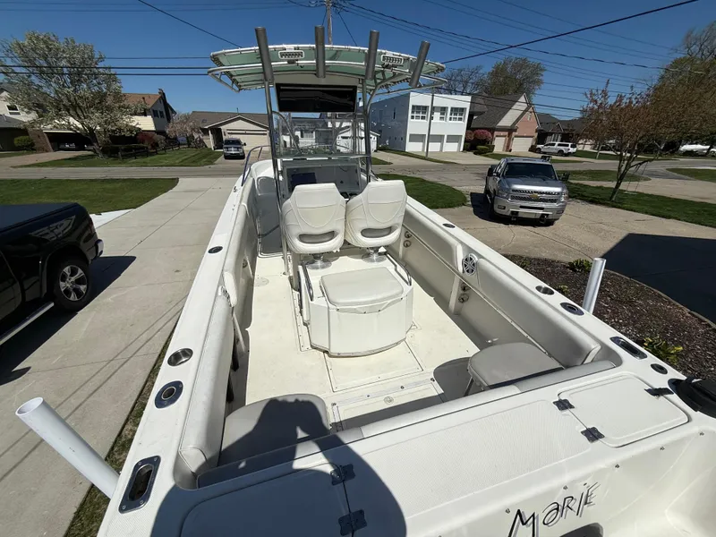 Slide: The Image of 1994 Fountain 31 Tournament Edition boat parked in a residential driveway. - 8