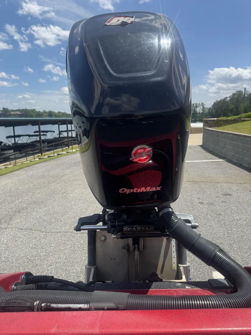 Slide: The Image of 2016 Nitro Z20 boat with OptiMax engine at a lakeside dock. - 11