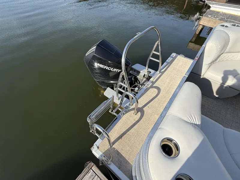 Slide: The Image of 2019 Crestliner 220 Rally DX boat with Mercury outboard motor and swim ladder. - 10