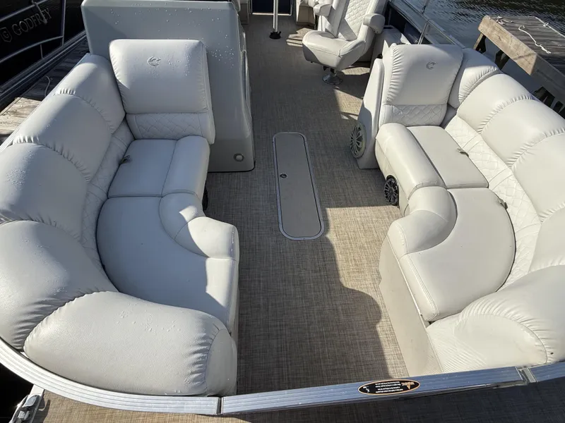Slide: The Image of 2019 Crestliner 220 Rally DX Center Walk-through boat interior with plush seating and spacious layout. - 11