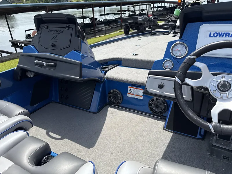 Slide: The Image of Interior of a 2022 Nitro Z20 Pro boat with steering wheel and dashboard. - 11