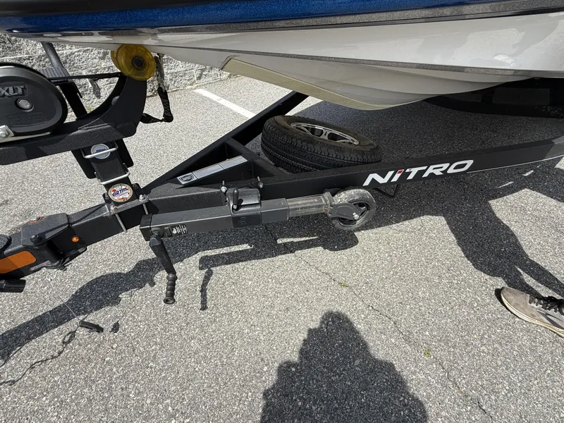 Slide: The Image of Trailer hitch of a 2022 Nitro Z20 Pro boat on asphalt. - 14