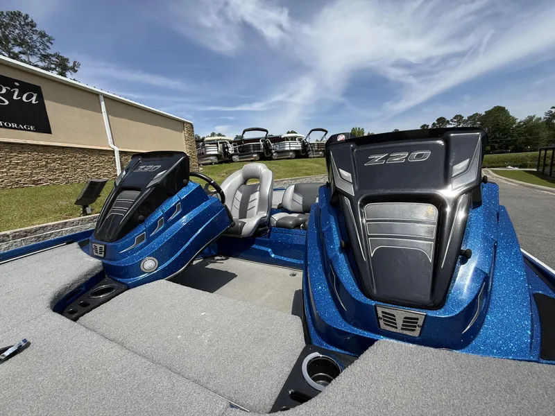 Slide: The Image of 2022 Nitro Z20 Pro boat with dual engines, blue finish, parked outdoors. - 16