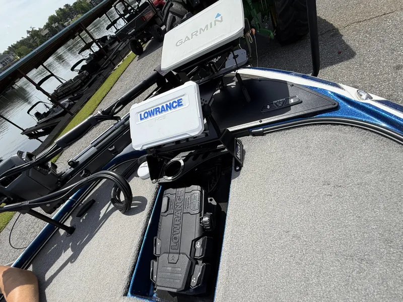 Slide: The Image of Fishing boat with Garmin and Lowrance equipment, Nitro Z20 Pro, 2022 model, docked by a lake. - 4