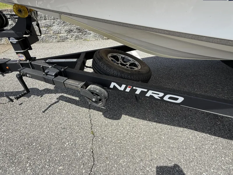 Slide: The Image of Trailer of 2022 Nitro Z20 Pro boat on asphalt surface. - 6