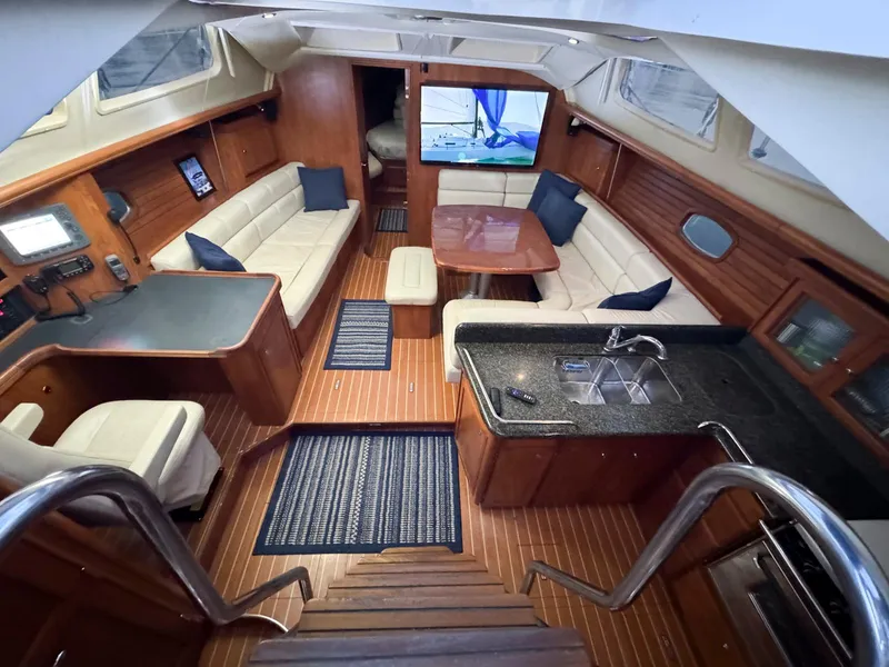 Slide: The Image of Luxurious interior of 2009 Hunter 50 Center Cockpit yacht with elegant wood finish and modern amenities. - 16
