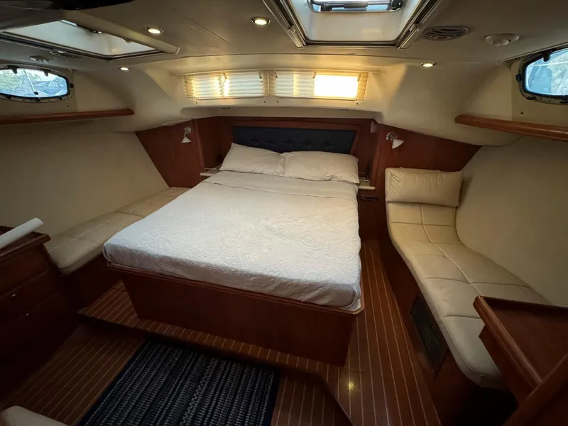 Slide: The Image of Luxurious cabin interior of 2009 Hunter 50 Center Cockpit yacht with cozy bed and seating. - 18