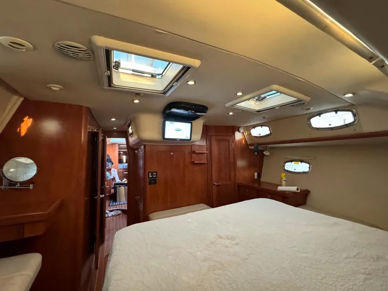 Slide: The Image of Luxurious interior of 2009 Hunter 50 Center Cockpit yacht with wood finish and skylights. - 19