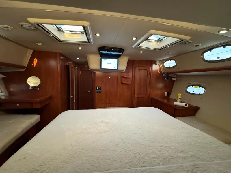 Slide: The Image of Luxurious interior of 2009 Hunter 50 Center Cockpit yacht with wood finish and skylights. - 20