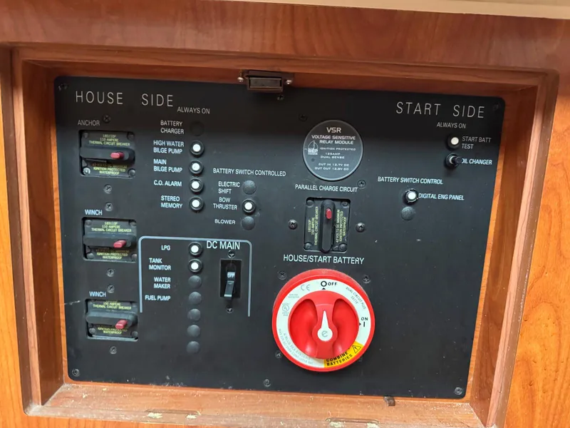 Slide: The Image of Control panel of a 2009 Hunter 50 Center Cockpit sailboat with battery switches and circuit breakers. - 26