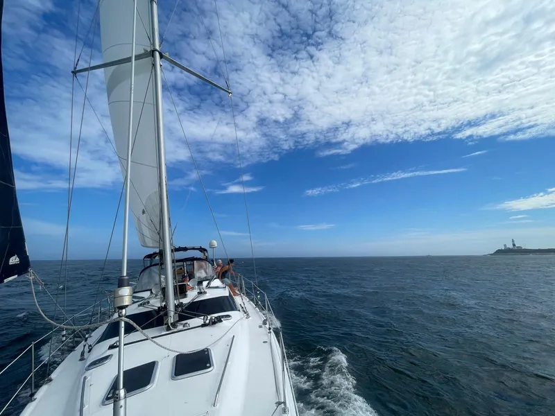 Slide: The Image of Sailing on a 2009 Hunter 50 Center Cockpit under a clear blue sky. - 6