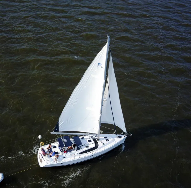 Slide: The Image of Aerial view of 2009 Hunter 50 Center Cockpit sailboat navigating on open water. - 8