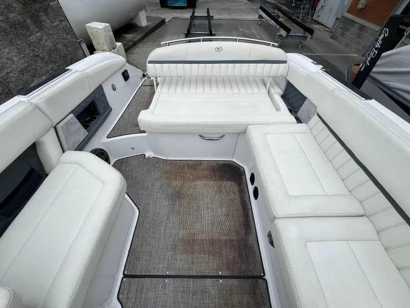 Slide: The Image of 2017 Cobalt A28 boat interior with white seating and gray flooring. - 13