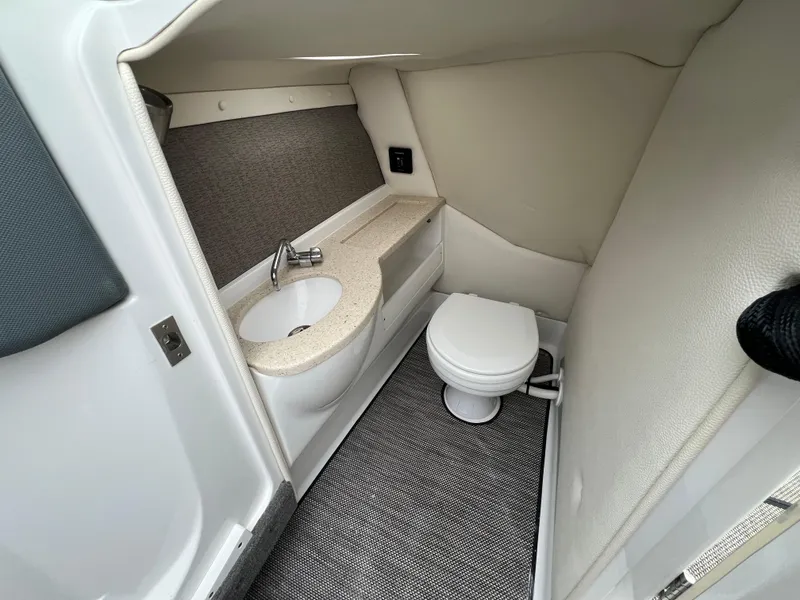 Slide: The Image of 2017 Cobalt A28 boat interior bathroom with sink and toilet. - 19