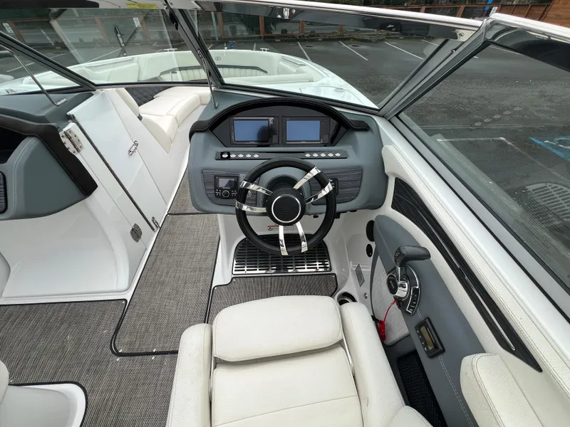 Slide: The Image of 2017 Cobalt A28 boat cockpit with modern steering and dashboard controls. - 21