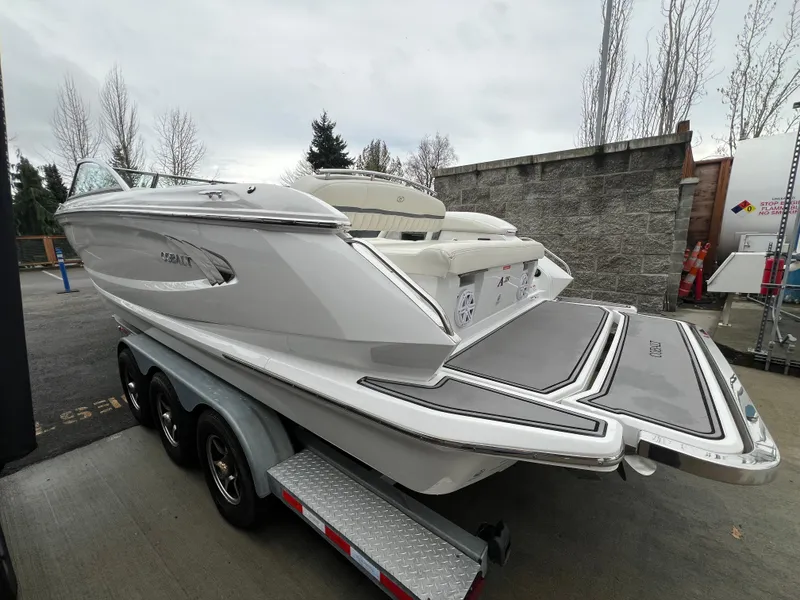 Slide: The Image of 2017 Cobalt A28 boat on trailer, rear view, parked outdoors. - 7