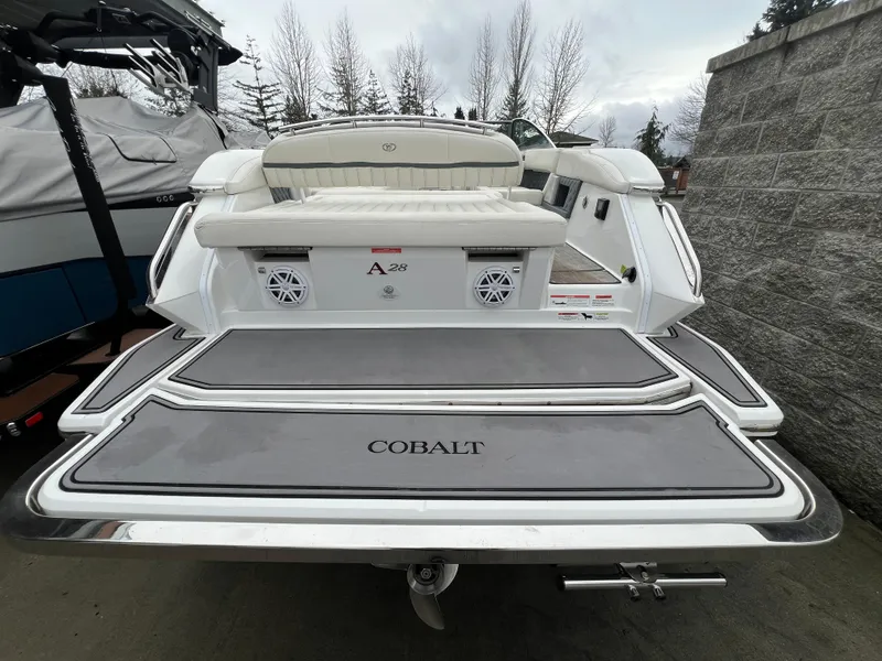 Slide: The Image of 2017 Cobalt A28 boat rear view with swim platform and speakers. - 8