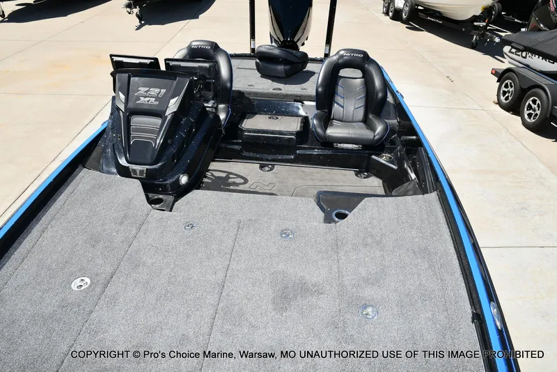 Slide: The Image of 2024 Nitro Z21 XL Pro Pack boat with dual seats and spacious deck. - 10