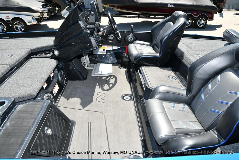 Slide: The Image of 2024 Nitro Z21 XL Pro Pack boat interior with sleek seating and modern dashboard. - 13