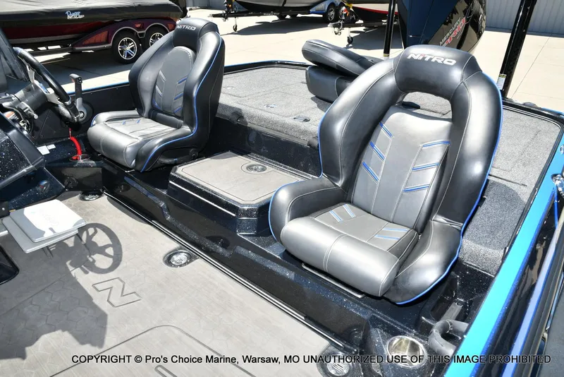 Slide: The Image of 2024 Nitro Z21 XL Pro Pack boat interior with sleek black seats and modern design. - 14