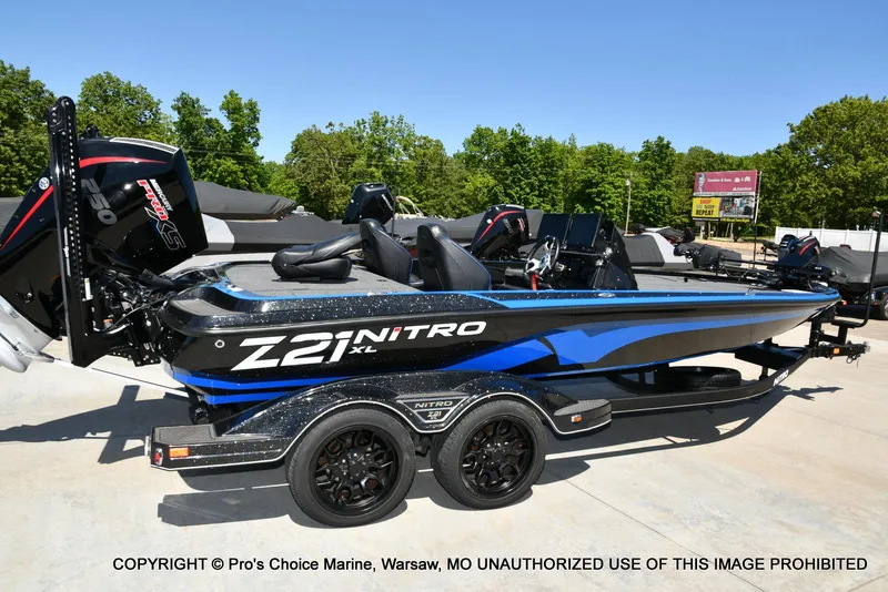 Slide: The Image of 2024 Nitro Z21 XL Pro Pack boat with sleek design and powerful engine. - 18