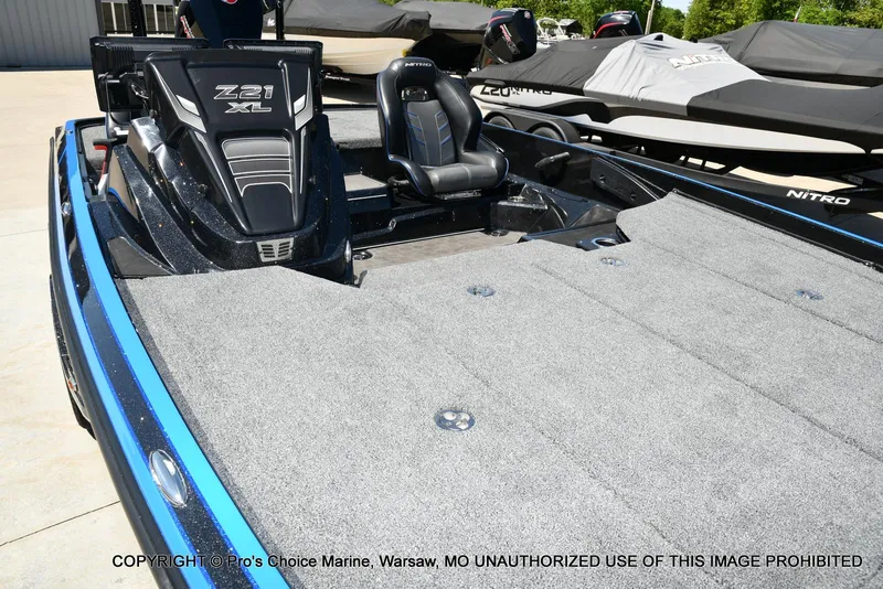 Slide: The Image of 2024 Nitro Z21 XL Pro Pack boat with spacious deck and sleek design. - 34