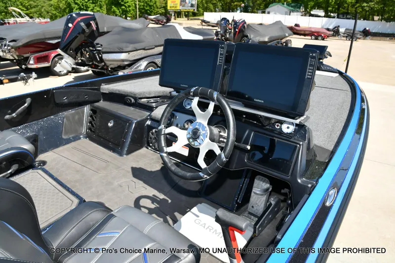 Slide: The Image of 2024 Nitro Z21 XL Pro Pack boat interior with dual Garmin displays and steering wheel. - 4