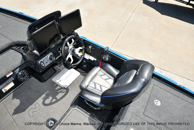 Slide: The Image of 2024 Nitro Z21 XL Pro Pack boat cockpit with steering wheel and dual screens. - 40