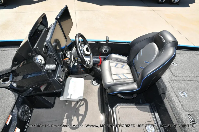 Slide: The Image of 2024 Nitro Z21 XL Pro Pack boat cockpit with steering wheel and seat. - 41