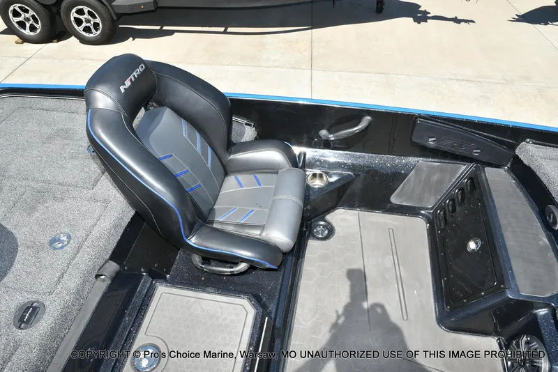 Slide: The Image of 2024 Nitro Z21 XL Pro Pack boat interior with black and blue seating. - 42
