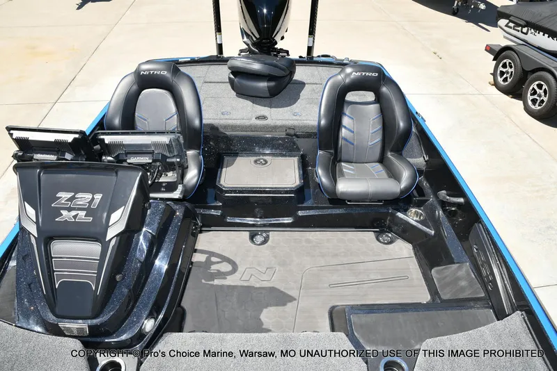 Slide: The Image of 2024 Nitro Z21 XL Pro Pack boat interior with dual seats and Garmin electronics. - 45