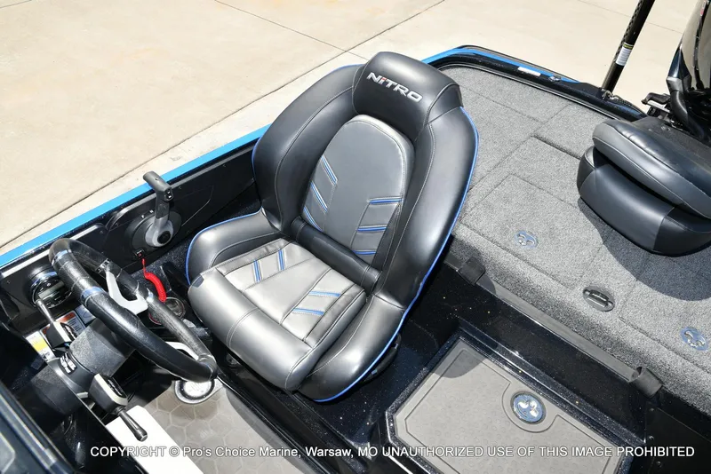 Slide: The Image of 2024 Nitro Z21 XL Pro Pack boat interior with sleek black seating and modern controls. - 47