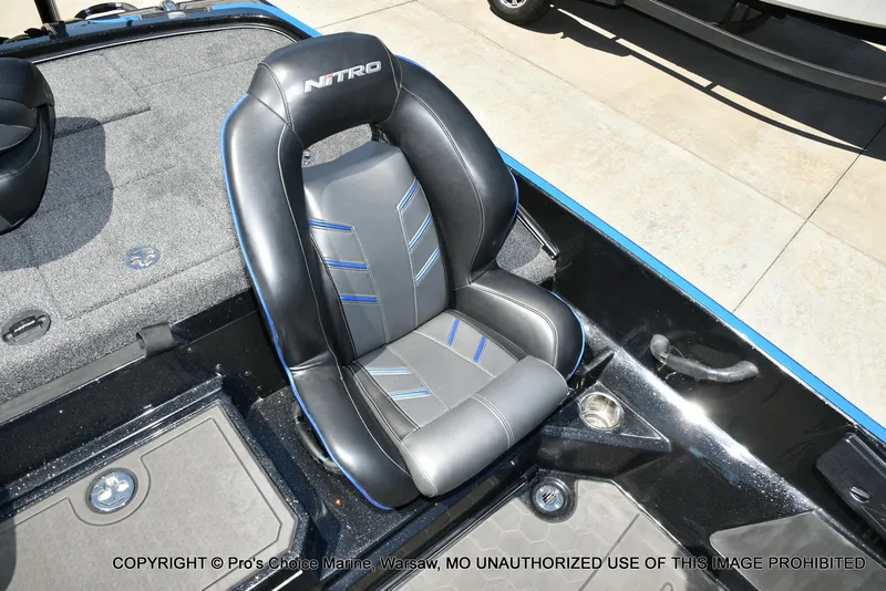 Slide: The Image of 2024 Nitro Z21 XL Pro Pack boat seat with sleek black and blue design. - 48