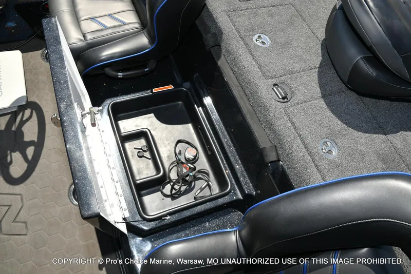 Slide: The Image of 2024 Nitro Z21 XL Pro Pack boat interior with storage compartment and seating. - 49