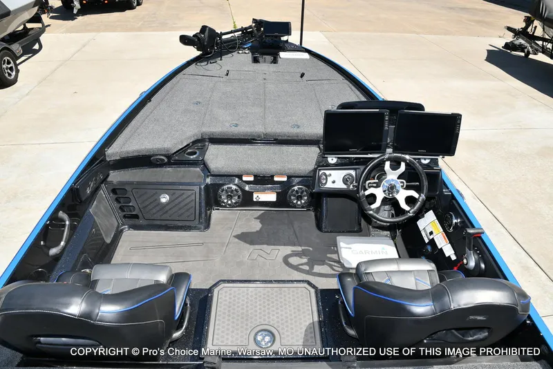 Slide: The Image of 2024 Nitro Z21 XL Pro Pack boat interior with dual Garmin displays and steering wheel. - 6